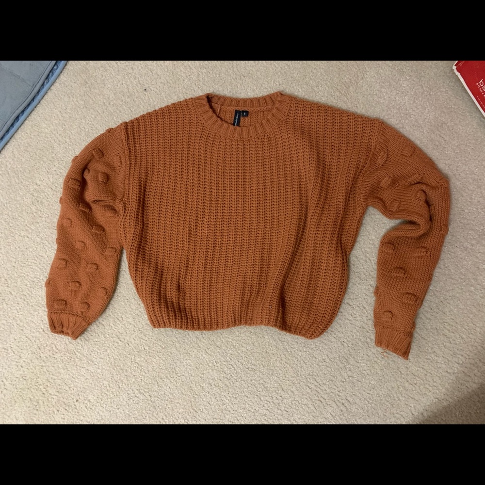 Cropped sweater with beautiful sleeve detail!